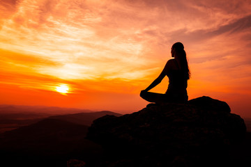 Yoga practicioner in sunset