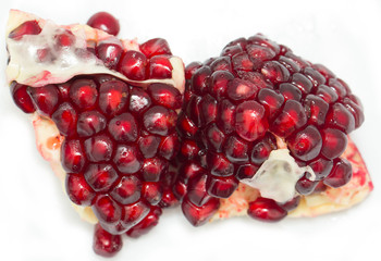 pomegranate seeds on a white background