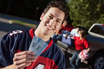 Foto op Canvas Tailgating: Man Holding Tickets To Football Game © seanlockephotography