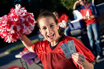 Foto op Plexiglas Tailgating: Woman Holding Pair Of Tickets To Football Game © seanlockephotography