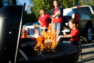 Poster Tailgating: Flames Rise As Charcoal Is Prepped For Cooking © seanlockephotography