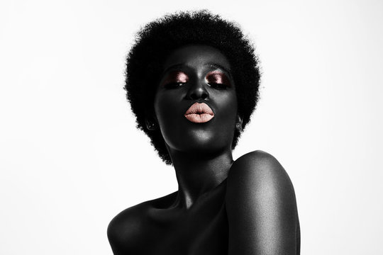 black colored woman sending kiss with light pink lips