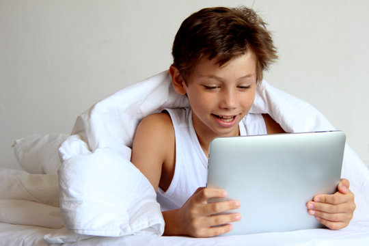 teen boy with tablet