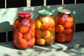 Preserved tomatoes in the glass cans