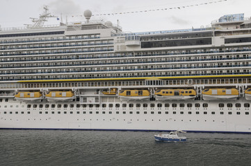  flank of ship from cruise with small boat