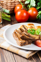 Pork spareribs served with silesian noodles and sauce