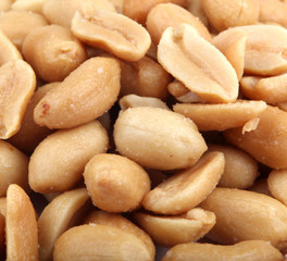 Fototapeta na wymiar Close up of fried, peeled and salted peanuts.