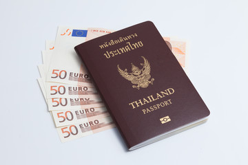 Thai passport with euro currency.