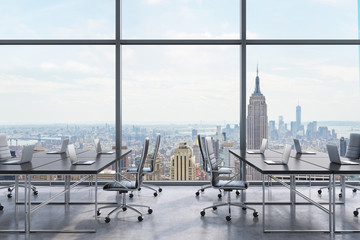 Workplaces in a modern panoramic office, New York city view from the windows. Open space. Black...