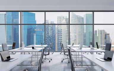 Workplaces in a modern panoramic office, Singapore city view from the windows. Open space. White...