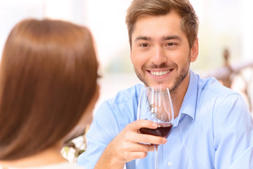 Loving couple drinking wine 