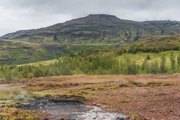 Icelandic natural landscape with hot springs, summer time