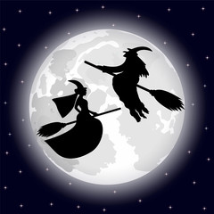 two witches on a background of the full moon on Halloween night
