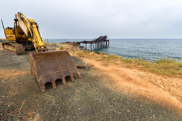 excavator standing on the pier