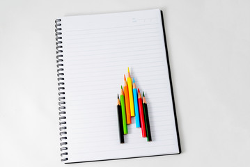 Notebook with a pencil.