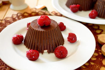 Homemade custard ice cream, covered with chocolate and cherries