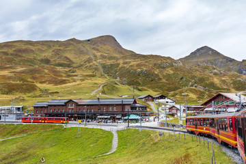 Fototapeta na wymiar Kleine Scheidegg railway station on Alpine mountains in Switzerland.