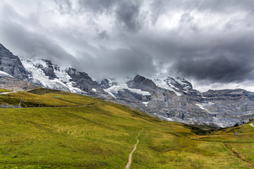 View of Eiger, Monch and Jungfrau massif from Kleine Scheidegg railway station on Swiss Alps, Switzerland, Europe