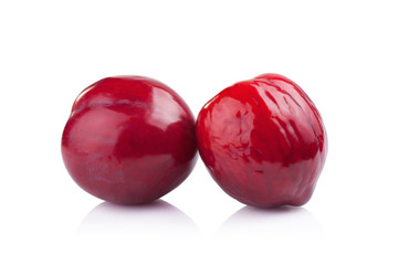 plums isolated on white
