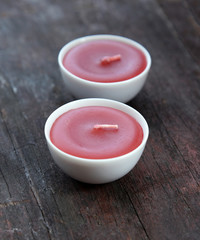 candle on old wooden table