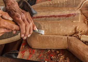 hands of the craftsman carve
