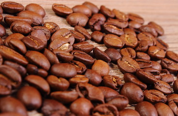 Heap of coffee on wooden background