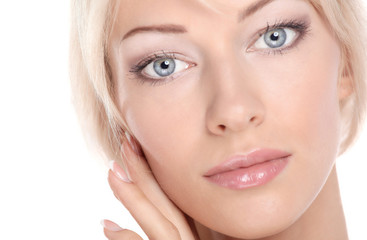 Fototapeta premium Close up portrait of beautiful young woman face. Isolated on