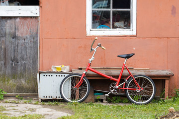 Fototapeta na wymiar Old vintage bicycle near shed