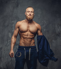 Obraz na płótnie Canvas Handsome muscular man with beard.