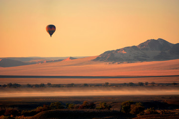 Hot air balloons in Sossusvlei dunes, Namib desert, Namibia