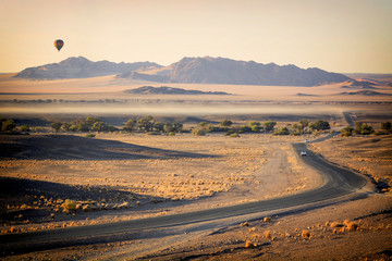 Hot air balloons in Sossusvlei dunes, Namib desert, Namibia