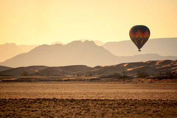 Hot air balloons in Sossusvlei dunes, Namib desert, Namibia