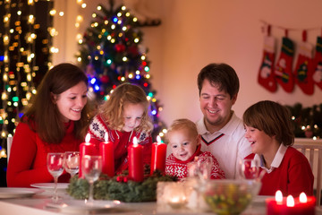 Fototapeta na wymiar Family enjoying Christmas dinner at home