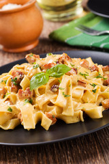 Pasta Carbonara with bacon, basil and cheese