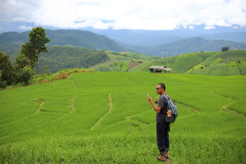 Fototapeta premium Man and Rice terraces in Mae Chaem at Thailand