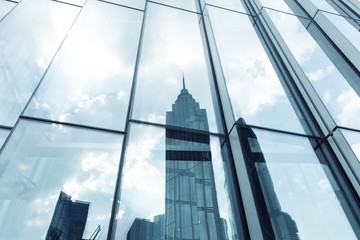 Fototapeta na wymiar landmarks reflection on glass walls of skyscrapers