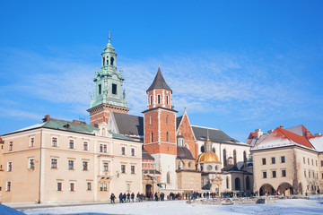 :Tourists in the territory of the Wawel castle. Wawel - the hill and an architectural complex in Krakow, on the left coast of Vistula.