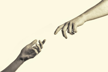 two hands reaching toward each other