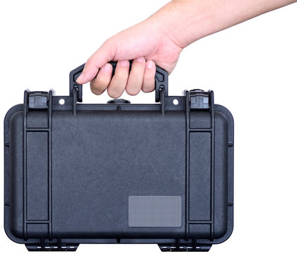 Hand is holding a black watertight suitcase