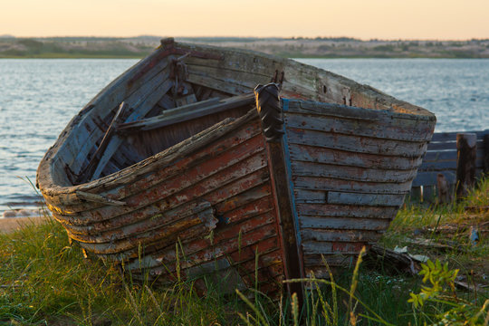 the wooden boat on the river in the morning