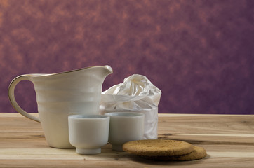 still life of jug and cookies