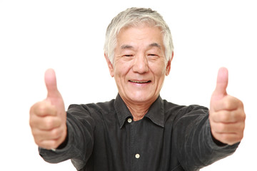 senior Japanese man with thumbs up gesture