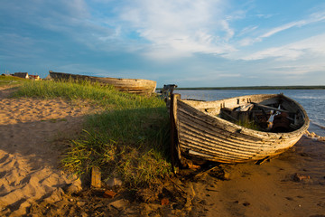 old wooden boats ashore in the morning © Andrey Oleshko