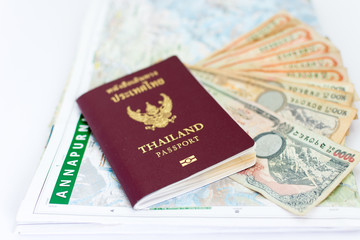 Thailand passport for tourism with Annapurna Region Nepal map and Nepali notes.