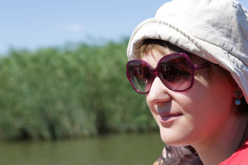 Woman on the reed background