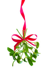 Mistletoe bunch hanged on red ribbon isolated on a white background