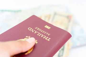 Thailand passport for tourism hold in hand