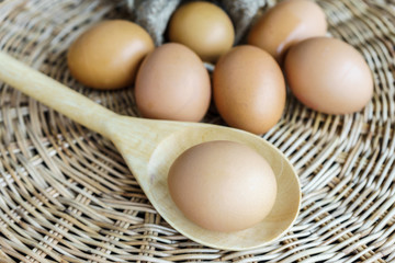 eggs and egg lay on wooden ladle