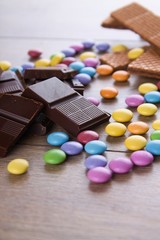 Pieces of bitter chocolate with other sweets