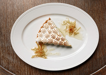 Meringue dessert on wooden table